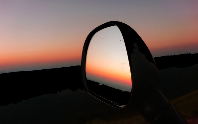 Sunset in the rearview mirror